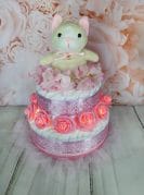 Roosa mähkmetort valgustusega