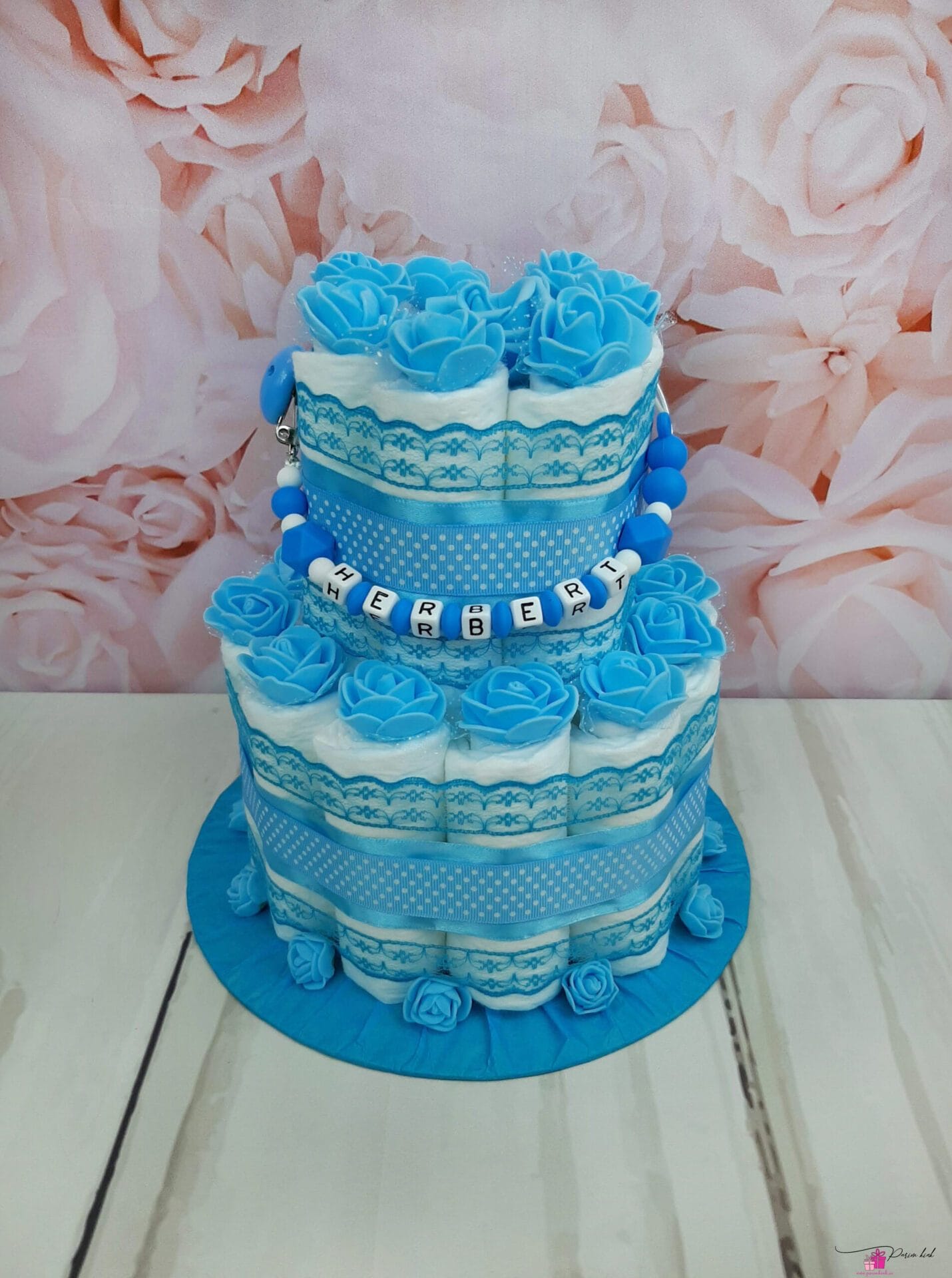 Tumesinine väike mähkmetort lutiketiga 1