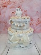 Beež mähkmetort lutiketi ja närimisrõngaga