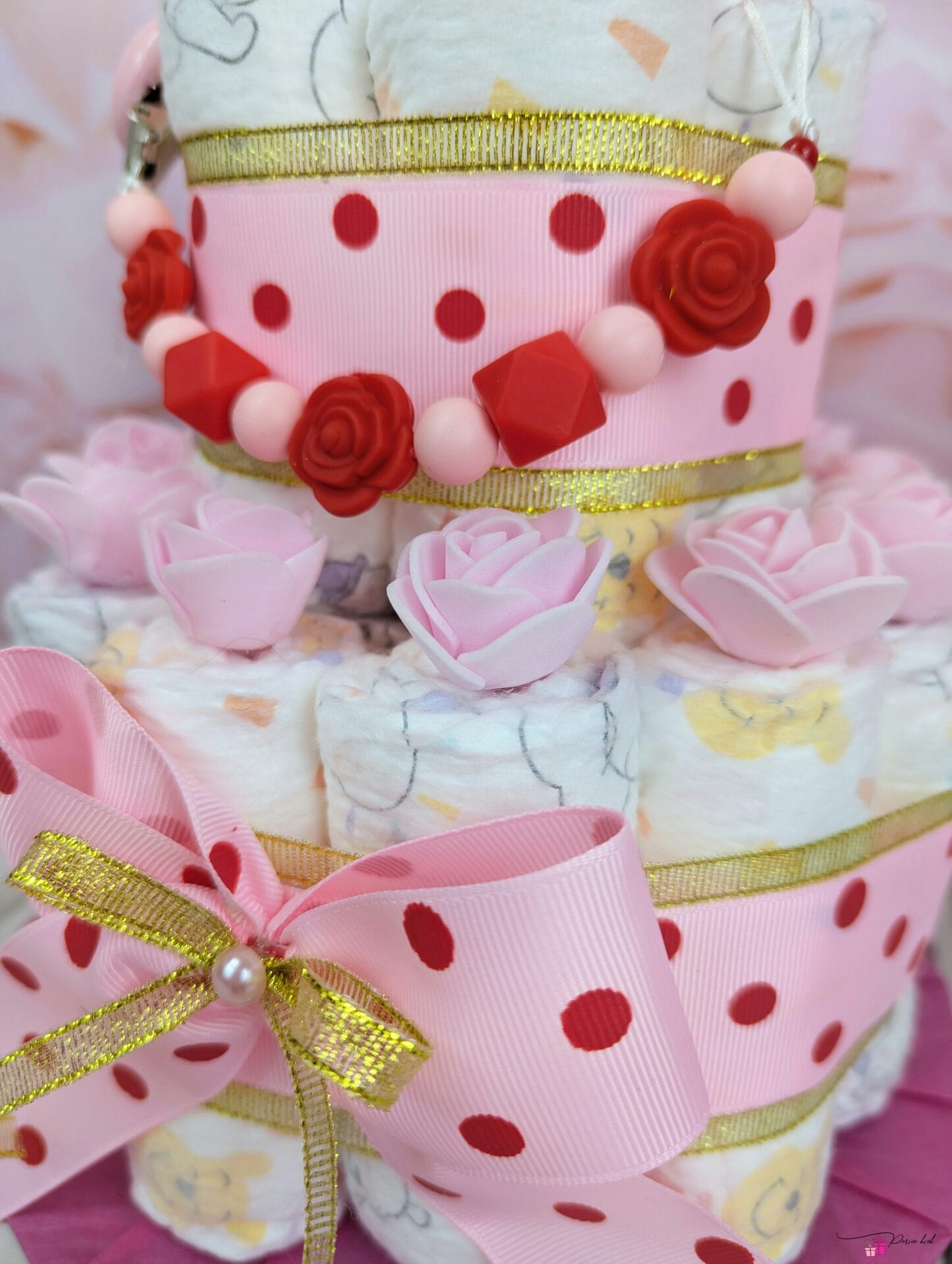 Roosa täpiline mähkmetort lutiketiga 1