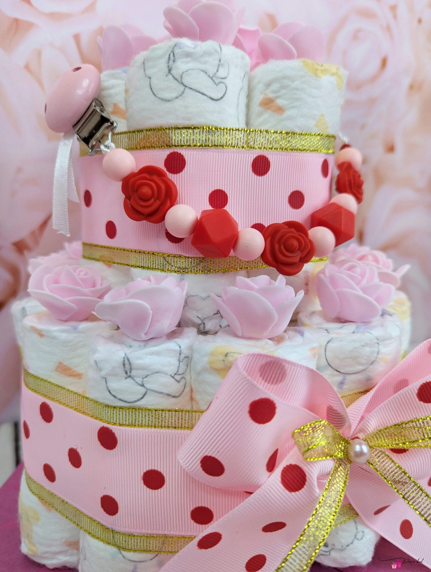 Roosa täpiline mähkmetort lutiketiga 2